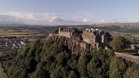Stirling castle aerial pan and orbital shot from east to west, looking north on a bright and sunny day
