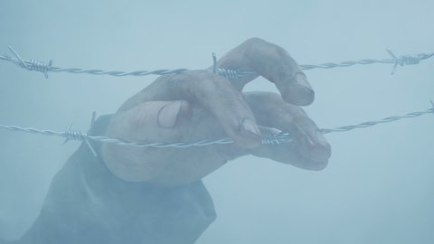 Soldier's Hand Caught On Barbed Wire In Smoke