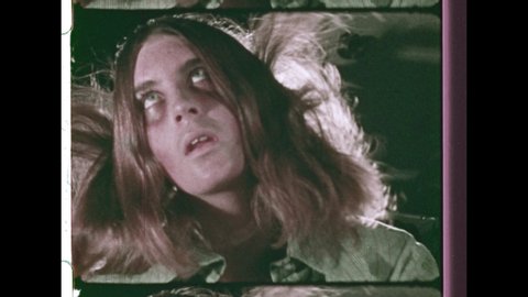 1970's A Young Girl Overdoes on Pills. A Young Man on a Stretcher Convulsing from Drug Overdose is loaded into an Ambulance. 4K Overscan of 16mm Film Showing Frame Lines & Sprocket Holes 