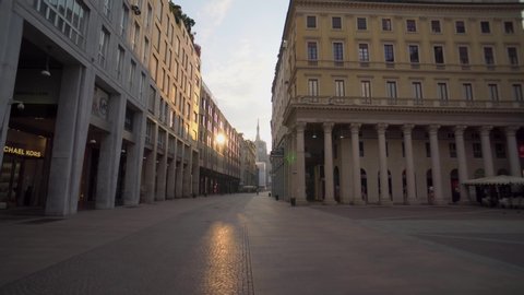 Milan, Italy, April 4, 2020. Empty city streets without people during quarantine from the coronavirus COVID19. Corso Vittorio Emanuele II.Closed shops, bars. Economic crisis. Spring. Architecture. 