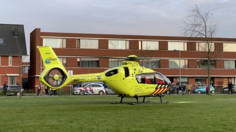 The Hague, The Netherlands - April 2020: Erasmus MC Medical Center Mobile Team Rescue Chopper yellow ANWB emergency helicopter.