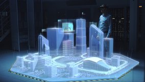 Industry 4.0: Modern Professional Architect Wearing Virtual Reality Headset Uses Gestures to Move, Design and Manipulate Buildings for 3D City. Mixed Augmented Reality Software. VFX Visual Effects - Powered by Shutterstock - Get 15% off with code: PIKWIZARD15