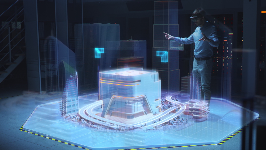 Industry 4.0: Modern Professional Architect Wearing Virtual Reality Headset Uses Gestures to Move, Design and Manipulate Buildings for 3D City. Mixed Augmented Reality Software. Special Visual Effects | Shutterstock HD Video #1049967763