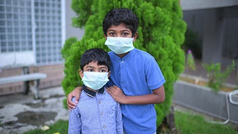 Stay at home .Coronavirus covid-19 infected.Asian Boy with sibling Wearing Masks to Prevent Disease and Dust, pm.5,Stay at home quarantine coronavirus pandemic prevention.