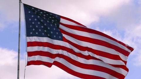 USA flag on flagpole. American Flag Waving. Close up of American flag waving. USA banner flaping in wind. US banner - American Flag waving in wind. American election concept