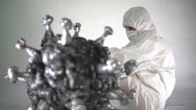 A sad man in protective clothing sits next to a coronavirus
 - Powered by Shutterstock - Get 15% off with code: PIKWIZARD15