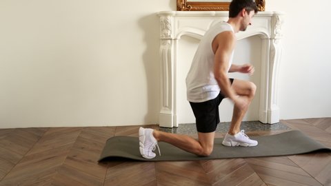 Man Doing Squats.Split Squats at Home Workout. Sports. Legs Close Up Shoot