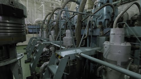 Piston near propulsion in engine room of vessel