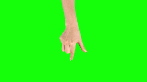 Female hand is performing pinch at tablet screen gesture on green screen. Close up