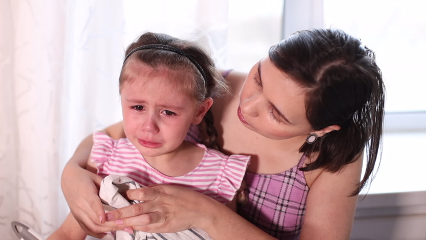 Caring mother comforting sad crying kid daughter feel hurt | Shutterstock HD Video #1049983714