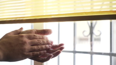 Close up of man hands clapping from his window, claps for healthcare workers