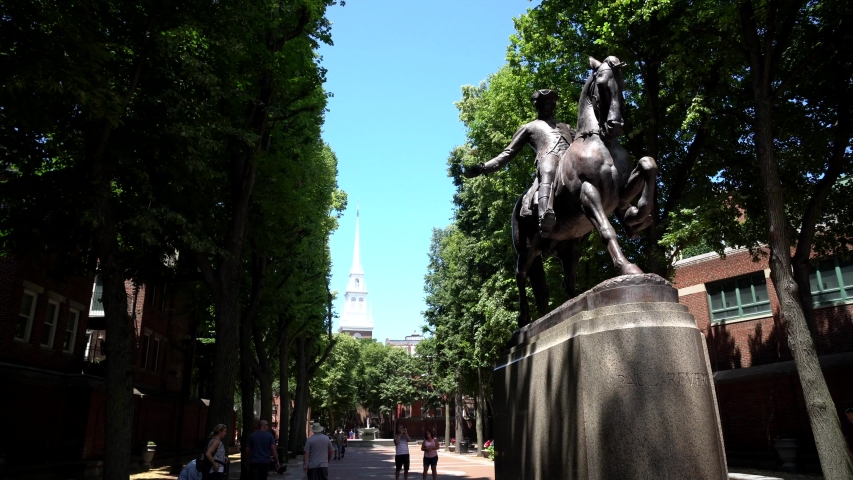 BOSTON, USA - JULY 16, 2019: Paul Revere Statue and Old North Church - Boston, Massachusetts, USA