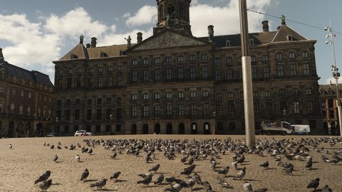 Deserted Dam square in Amsterdam during Corona pandemic.