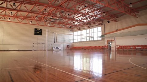 Oradea, Bihor / Romania 2019: College Empty Sports Hall Basketball Volleyball Court Light Sunshine