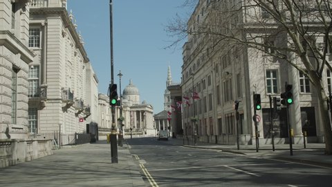 LONDON, ENGLAND, UK –  April 6 2020: Lockdown London, Empty road towards Trafalgar Square during coronavirus pandemic, no people