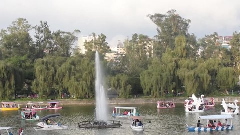 March 03, 2019- Baguio City Philippines: Tourist enjoy boating at the Burnham lake during a hot day