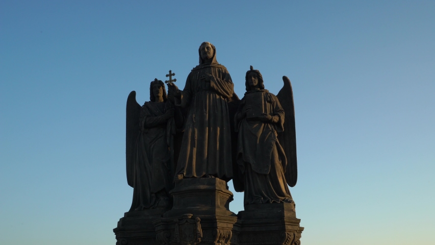 Statues of saint on Charles bridge in Prague. Saint Frantisek Serafinsky. Czech history and culture.