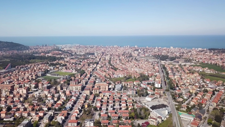 Panoramic view of the city of Pesaro in the Marche region of Italy with the Adriatic Sea in the background and Mount San Bartolo to the left