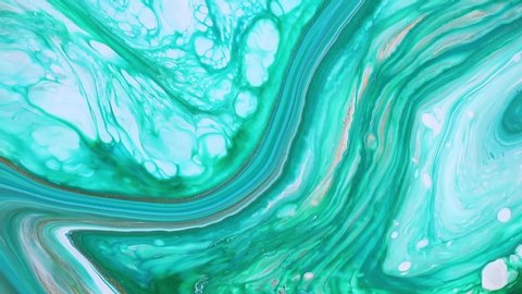 Fluid art drawing footage, abstract acrylic texture with flowing effect. Liquid paint mixing backdrop with splash and swirl. Detailed background motion with green and mint overflowing colors
