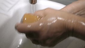 An elderly woman washes her hands to protect herself from the coronavirus COVID-19. Wrinkled old Hand wash them thoroughly with soap to protect themselves from the flu virus during a pandemic. - Powered by Shutterstock - Get 15% off with code: PIKWIZARD15