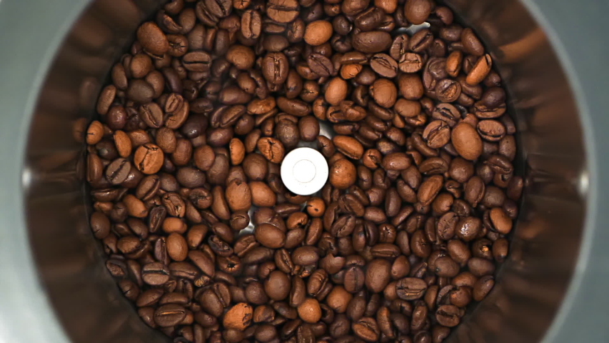 HD - Coffee grinder grinds coffee beans. Slow-mo Royalty-Free Stock Footage #1050065779