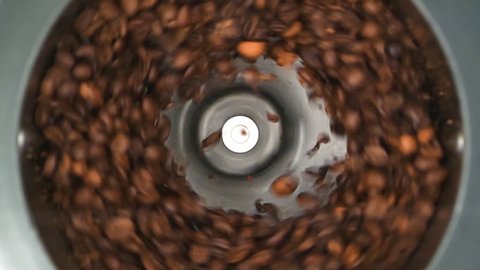 HD - Coffee grinder grinds coffee beans. Slow-mo