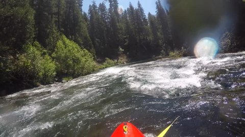 First person view of whitewater kayaker on the Rogue river in Southern Oregon, USA. 