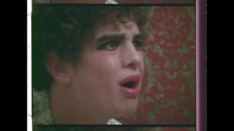 1970's Teenage Boy attempts to Kiss Girl and Fails. When he Looks in the Mirror the Boy is in Drag, dressed like a transvestite. 4K Overscan of 16mm Film Showing Frame Lines and Sprocket Holes
