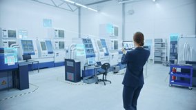 Industry 4.0 Factory: Female Engineer Uses Digital Tablet Computer with Augmented Reality Software to Connect with CNC Machinery, Robot Arm and Visualize Maintenance and Diagnostics of the Equipment - Powered by Shutterstock - Get 15% off with code: PIKWIZARD15