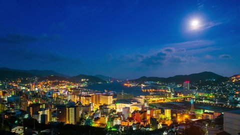 Nagasaki, Japan. A sunrise timelapse made from a hill in Nagasaki, Japan, with a view over the entire center, including the bay and the hills, zoom in