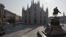 Everyday life in Milan, Italy during COVID-19 epidemic. Milano, Italian city and coronavirus lockdown. Aerial view of Piazza Duomo with cathedral seen from drone flying in sky - Powered by Shutterstock - Get 15% off with code: PIKWIZARD15