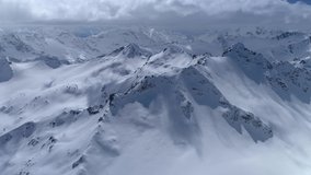 From great heigh fairytale mountain landscape snow covered alpine sharp peaks. Wild winter untouched inaccessible nature Russia Switzerland Alps abstract. Thick white clouds. Open space. Aerial 4K - Powered by Shutterstock - Get 15% off with code: PIKWIZARD15
