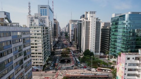 4K UHD Aerial moving time lapse in fast motion Paulista avenue, São Paulo, Brazil. High-rise buildings in landmark street. Long exposure city life and transportation, concept background.