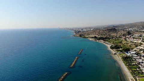 High Flying Aerial Shot Flying Backwards Over the Beach in Limassol, Cyprus