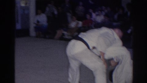 SAN GABRIEL CALIFORNIA-1966: Karate Master Demonstrating Sparing Class Disciplining Self-Defense With School Age Students