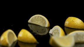 Endless lemon slices falling onto black surface - Powered by Shutterstock - Get 15% off with code: PIKWIZARD15