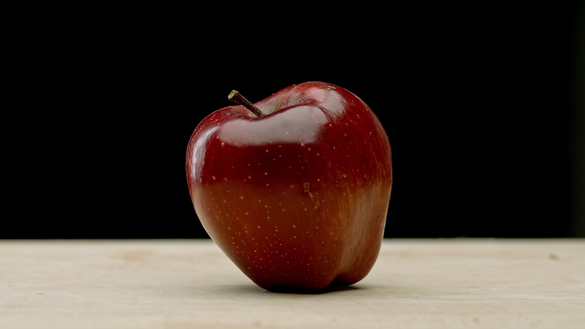 A red apple being chopped into four - Powered by Shutterstock - Get 15% off with code: PIKWIZARD15