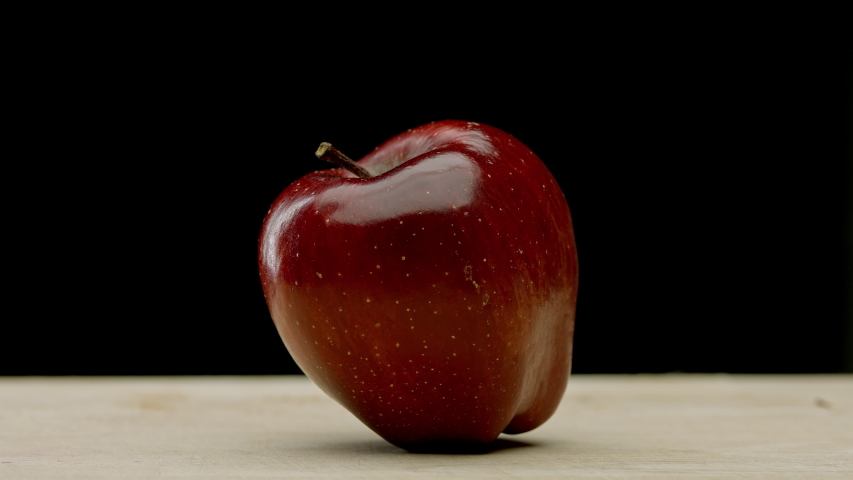 A red apple being chopped in half - Powered by Shutterstock - Get 15% off with code: PIKWIZARD15