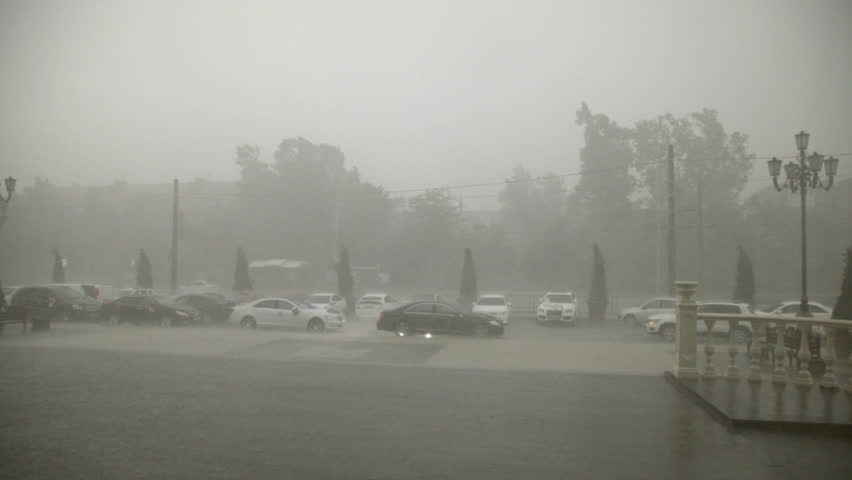 heavy rain and hail hit the city in the afternoon / Slow motion shot at 60 fps. You can  increase the speed to make 24 or 30 fps if you want