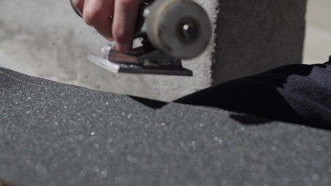 Sanding Edges Of Griptape On Skateboard Sunny