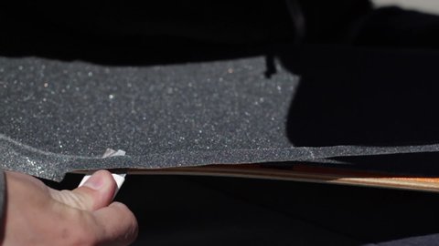Excellent Close Up Cutting Grip Tape On Skateboard