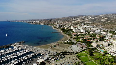 Aerial Shot Descending on a Resort with Beach, Water, Sand, Marina, and More in View in Limassol, Cyprus