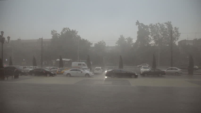 heavy rain and hail hit the city in the afternoon / Slow motion shot at 60 fps. You can  increase the speed to make 24 or 30 fps if you want