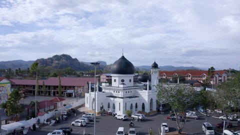 February 13th, 2013 - Perlis, Malaysia : 4K Aerial view of a Moorish Style White Mosque with Black dome. Establish view of state mosque in Perlis