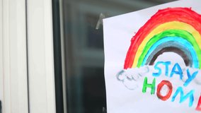 Child's Rainbow Painting With Stay Home Message During Coronavirus. - Powered by Shutterstock - Get 15% off with code: PIKWIZARD15