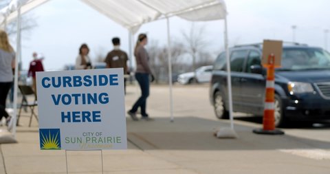 Election during the Coronavirus or Covid-19 pandemic, voters participating in a election in Madison, Wisconsin/USA April 7, 2020 