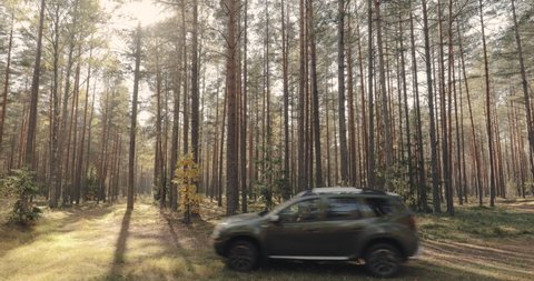 Volova Gora, Belarus - October 6, 2018: Car Renault Duster SUV in motion in autumn forest landscape. Duster produced jointly by French manufacturer Renault and its Romanian subsidiary Dacia