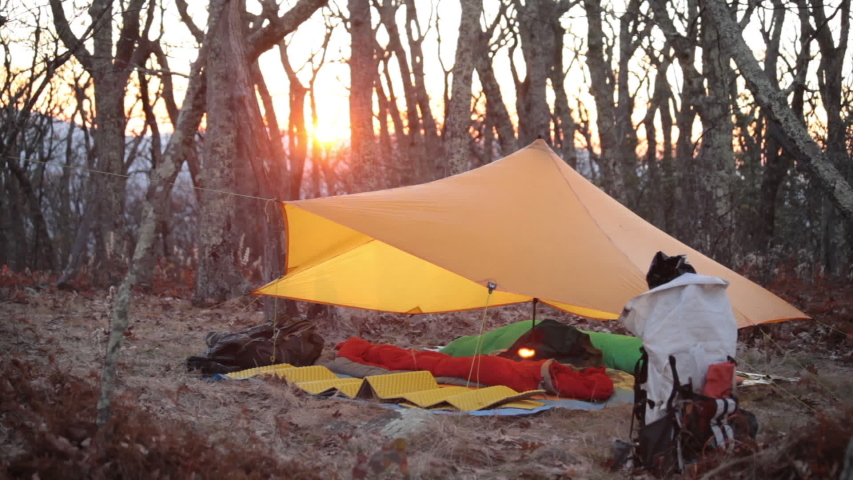 Sun Sets Behind Tarp Shelter Stock Footage Video 100 Royalty Free   1 