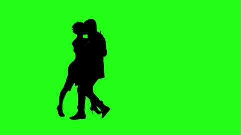 A Young couple dancing tango profesional dancers on Green Screen Silhouette Pair in argentinian spanish dress performs dance movement. 4K 60fps Argentina France Chroma key Argentina Buenos Aires Messi