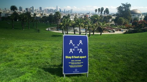 San Francisco, California / U.S.A. - April 3rd, 2020
Time lapse of Dolores Park with shelter in place keep 6 foot distance sign in San Francisco during Covid-19 pandemic.